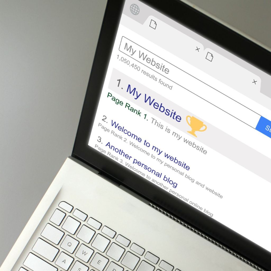 A close-up of a laptop screen displaying a search engine results page with 'My Website' listed at the top position and several other results below.